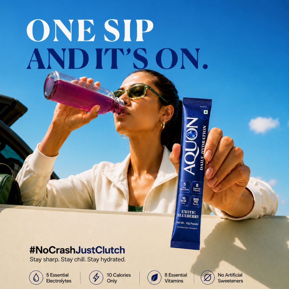 Woman drinking AQUON Exotic Blueberry electrolyte hydration from a bottle after activity