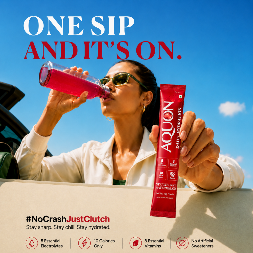 Woman drinking AQUON Strawberry Watermelon electrolyte hydration from a bottle after activity